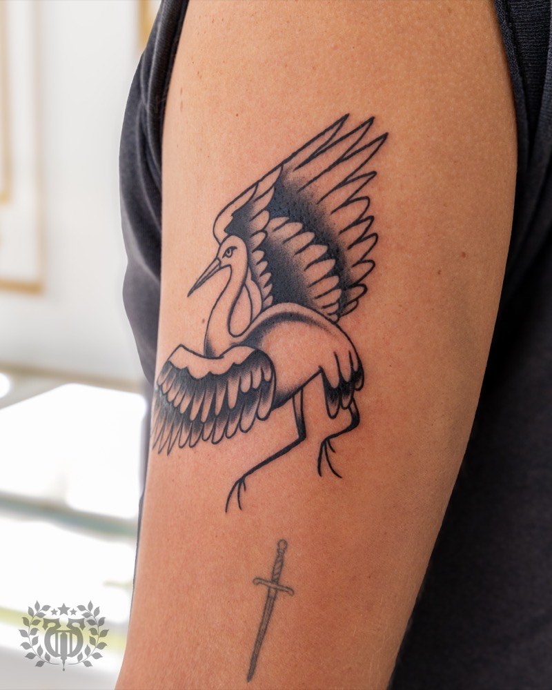 Ornamental forearm band tattoo — solid circumferential pattern