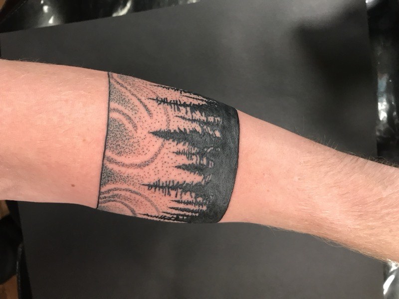Ornamental jewelry-inspired tattoo — crown and necklace extension