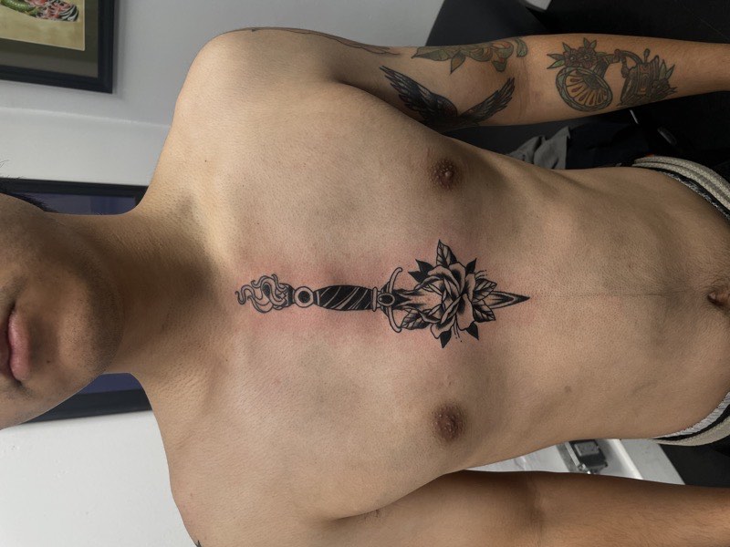 Ornamental tattoo — dense pattern composition on curved body
