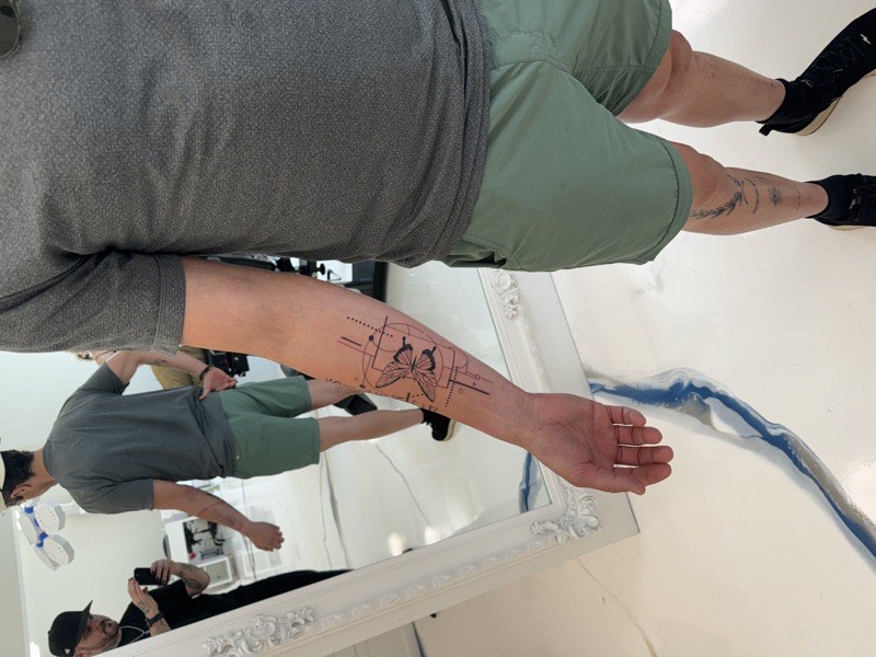 Fine line tattoo — micro illustrative subject