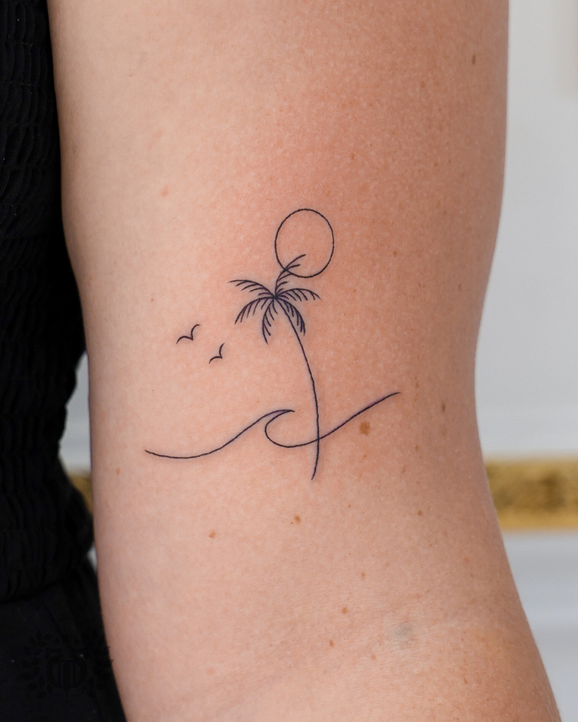 Palm tree wave and birds tattoo by fine line tattoo artist in Los Angeles