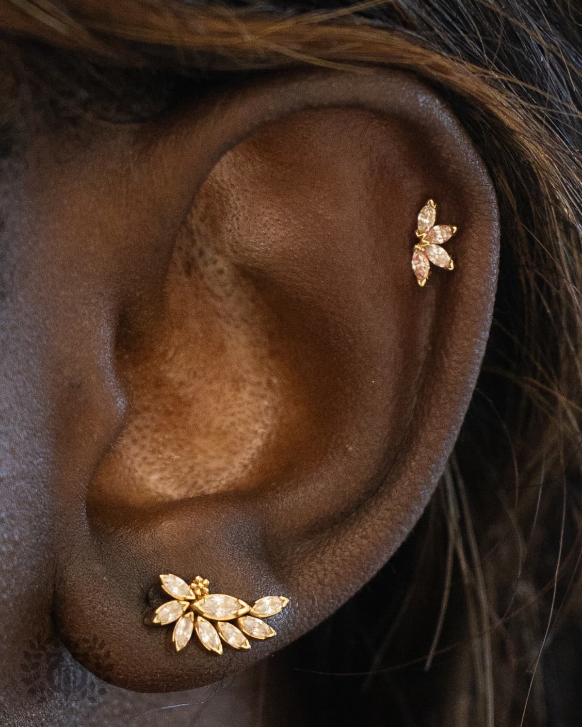 BVLA helix piercing with gemstone end at Apollo Tattoo Studio