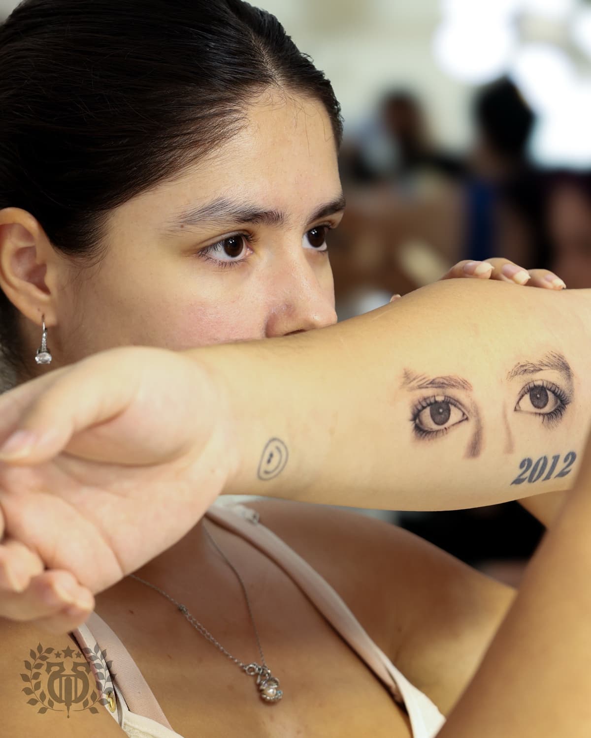 Realistic eyes portrait realism tattoo on inner forearm in Los Angeles