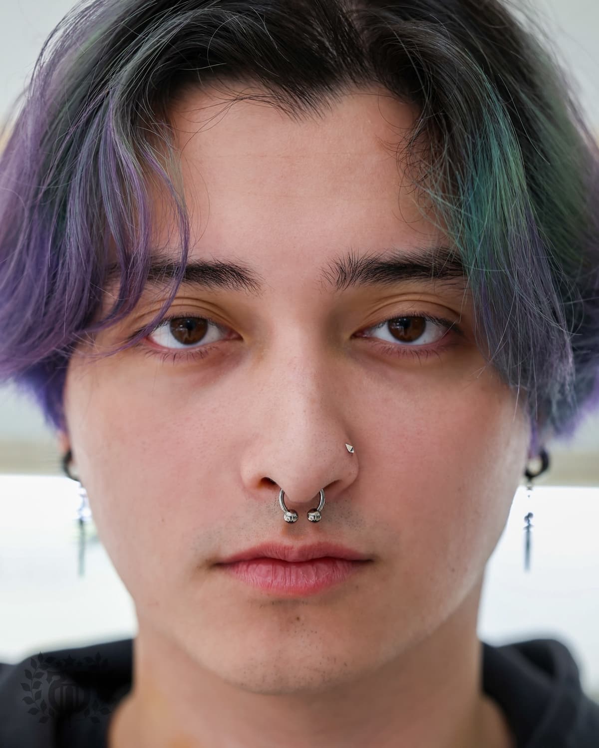 Expert piercer performing smiley piercing procedure at Apollo Studio