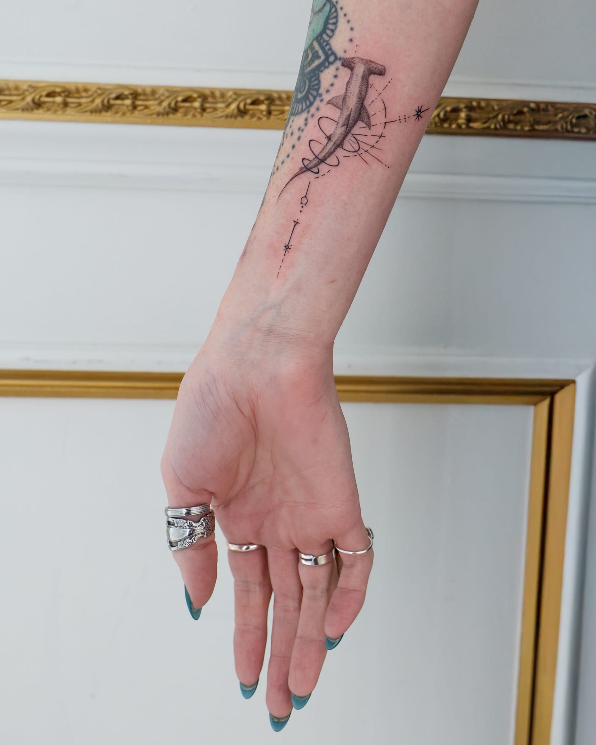 Fine line ornamental wrist tattoo at Apollo Studio Los Angeles