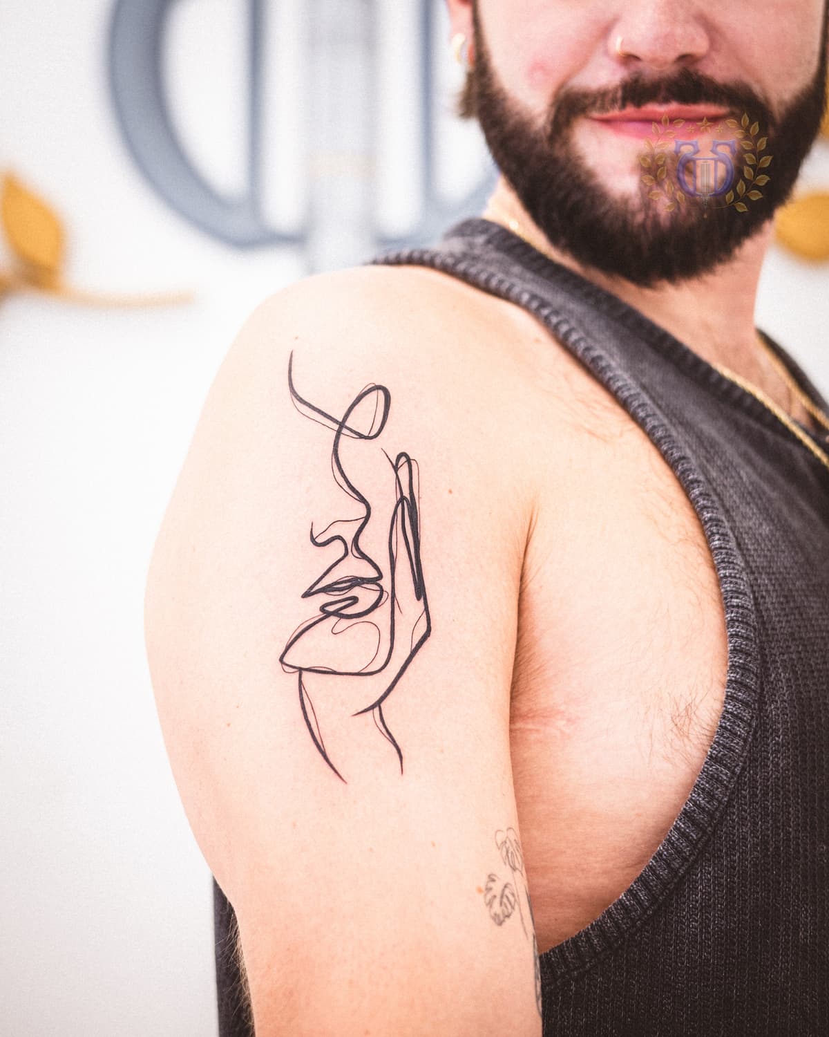 Minimalist single needle tattoo