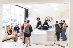 Customers check out with owner Blue Mason at the Apollo Studio front desk